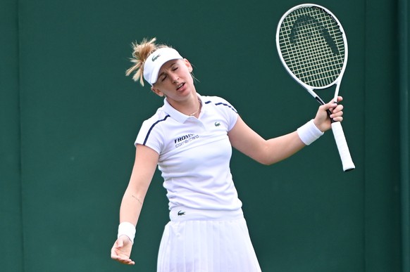 epa09313033 Jil Teichmann of Switzerland reacts during the 1st round match against Camila Giorgi of Italy at the Wimbledon Championships, Wimbledon, Britain 30 June 2021. EPA/NEIL HALL EDITORIAL USE O ...