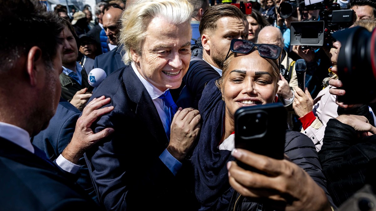 epa11391717 Party for Freedom (PVV) leader Geert Wilders poses for photos with supporters during an election campaign on the Hague Market, Netherlands, 05 June 2024. The PVV leader is campaigning for  ...