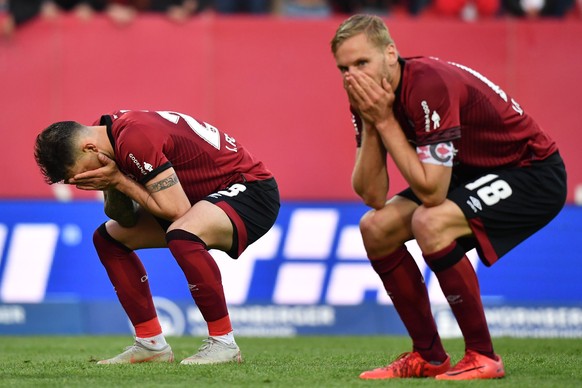 epa07535096 Nuernberg&#039;s Patrick Erras and Nuernberg&#039;s Hanno Behrens (L-R) react during the German Bundesliga soccer match between FC Nuernberg and FC Bayern in Nuremberg, Germany, 28 April 2 ...