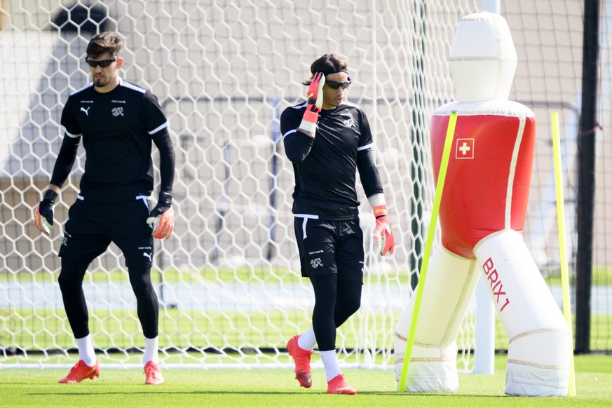 Switzerland&#039;s goalkeeper Gregor Kobel, left, and Switzerland&#039;s goalkeeper Yann Sommer, right, attend with glasses a closed training session of Swiss national soccer team in preparation for t ...