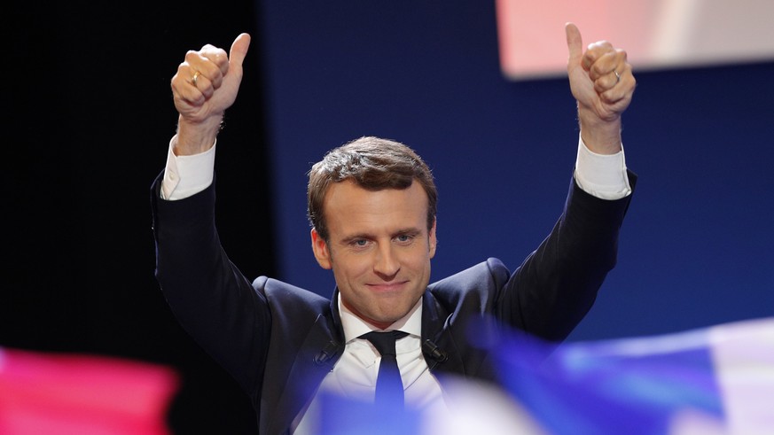 French centrist presidential candidate Emmanuel Macron thumbs as he addresses his supporters at his election day headquarters in Paris , Sunday April 23, 2017. Macron and far-right populist Marine Le  ...