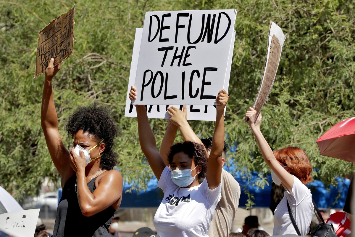 FILE - In this June 3, 2020, file photo, protesters rally in Phoenix, demanding the Phoenix City Council defund the Phoenix Police Department, following the death of George Floyd. Some Republican-cont ...
