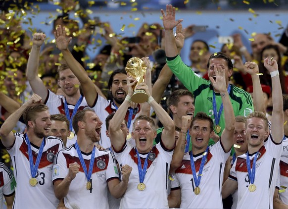 FILE - Germany&#039;s Bastian Schweinsteiger holds up the World Cup trophy following their 1-0 victory over Argentina after the World Cup final soccer match between Germany and Argentina at the Maraca ...