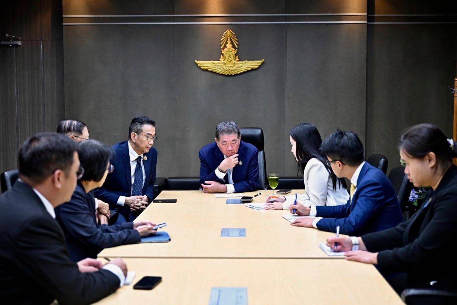 This image provided by the Thai Prime MInister&#039;s Office shows Thailand&#039;s Acting Prime Minister Phumtham Wechayachai, center, with his staff listening during his phone call with U.S. Presiden ...