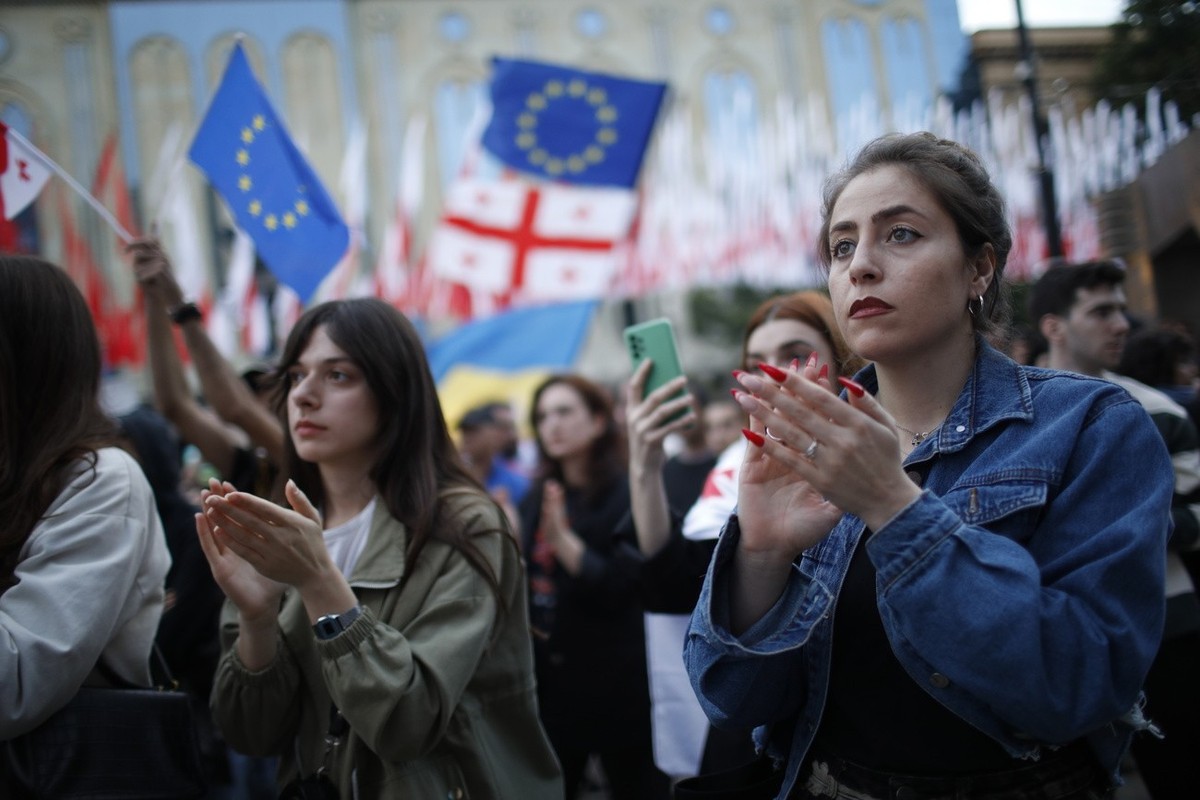 Georgians take part in a protest against a draft bill on 'foreign agents' near Parliament building in Tbilisi, Georgia, 28 May 2024.