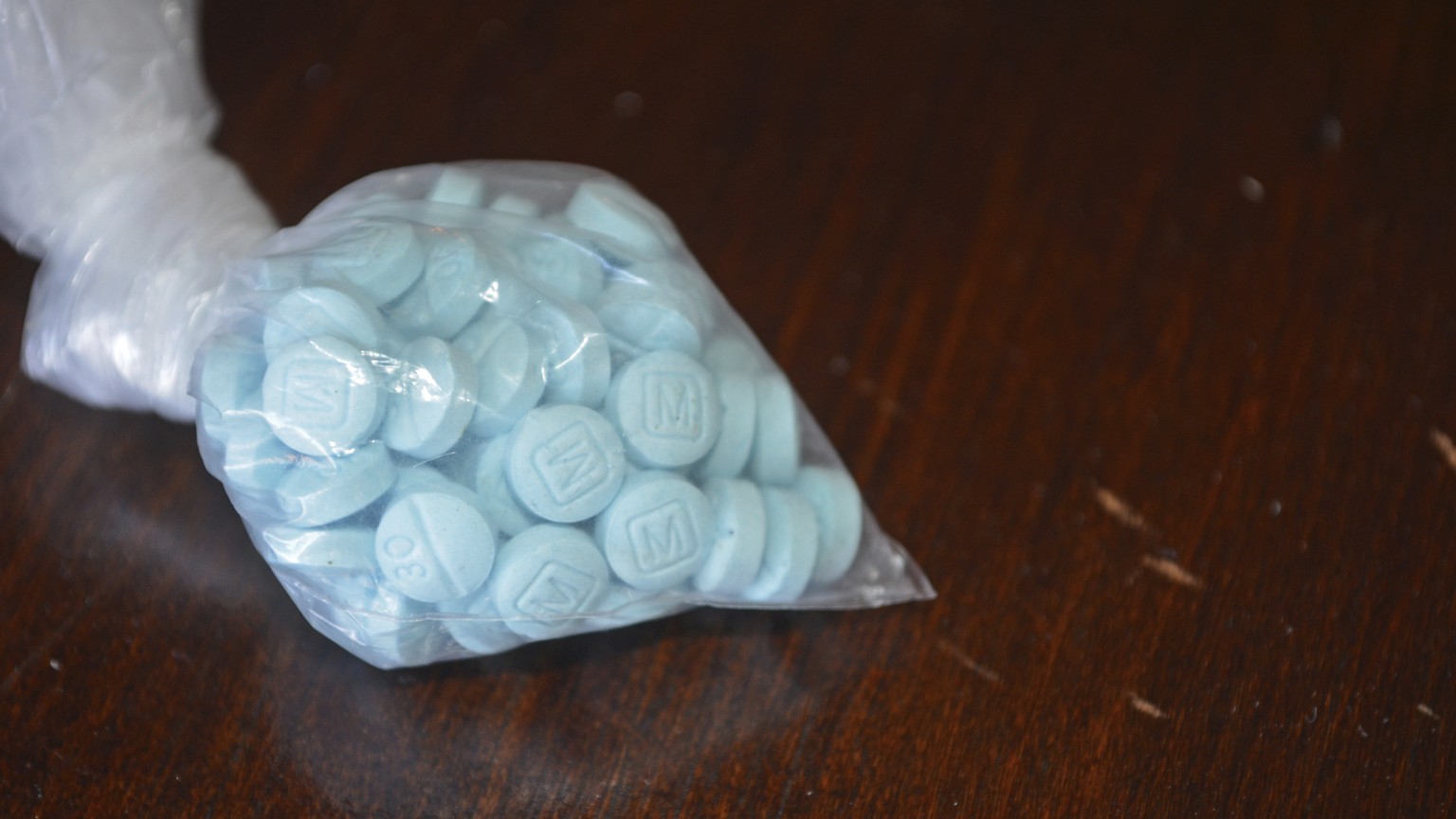 This undated photo provided by the U.S. Drug Enforcement Administration's Phoenix Division shows a closeup of the fentanyl-laced sky blue pills known on the street as &quot;Mexican oxy.&quot; Smuggled ...