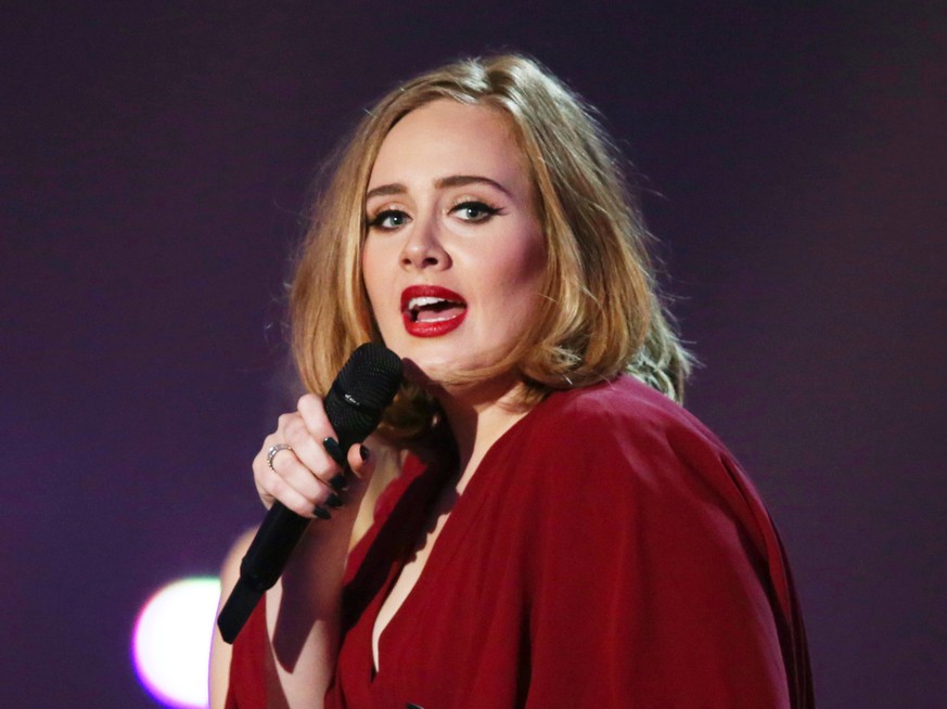 FILE - In this Feb. 24, 2016 file photo shows Adele onstage at the Brit Awards 2016 at the 02 Arena in London. Adele told the crowd at her show in New York City on Sept. 20, 2016, that news of Brad Pi ...