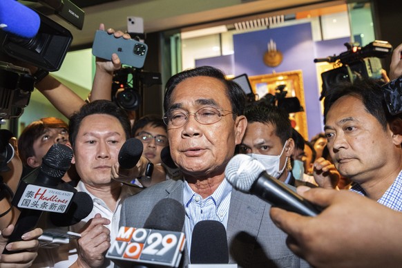 Thailand&#039;s Prime Minister Prayuth Chan-ocha leaves from United Thai Nation Party headquarters in Bangkok, Thailand, Sunday, May 14, 2023. Thailand&#039;s main opposition party took an early lead  ...