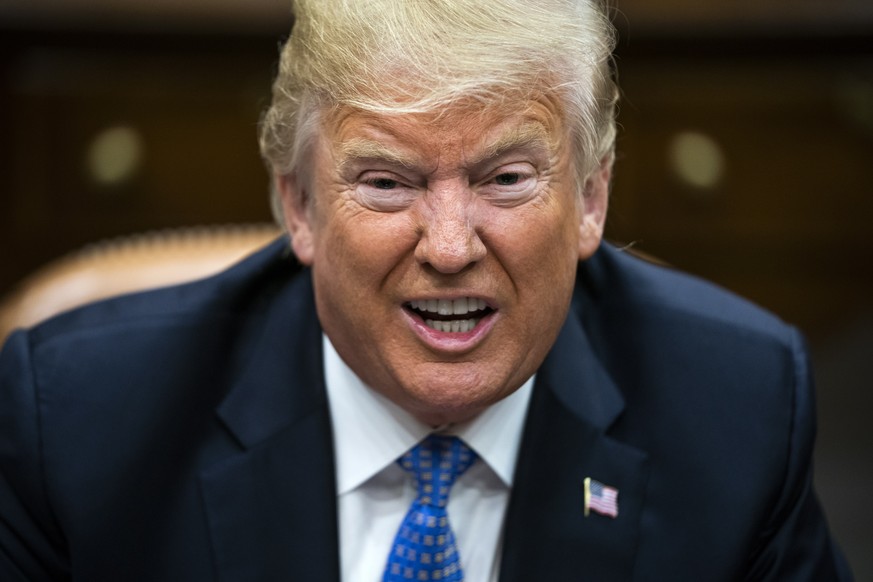 epa06966937 US President Donald J. Trump speaks with lawmakers during a roundtable discussion on the Foreign Investment Risk Review Modernization Act in the Roosevelt Room of the White House in Washin ...