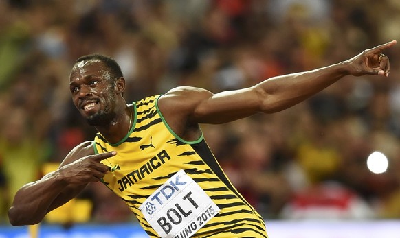 Usain Bolt of Jamaica celebrates winning the men&#039;s 100 metres final during the 15th IAAF World Championships at the National Stadium in Beijing, China August 23, 2015. REUTERS/Dylan Martinez