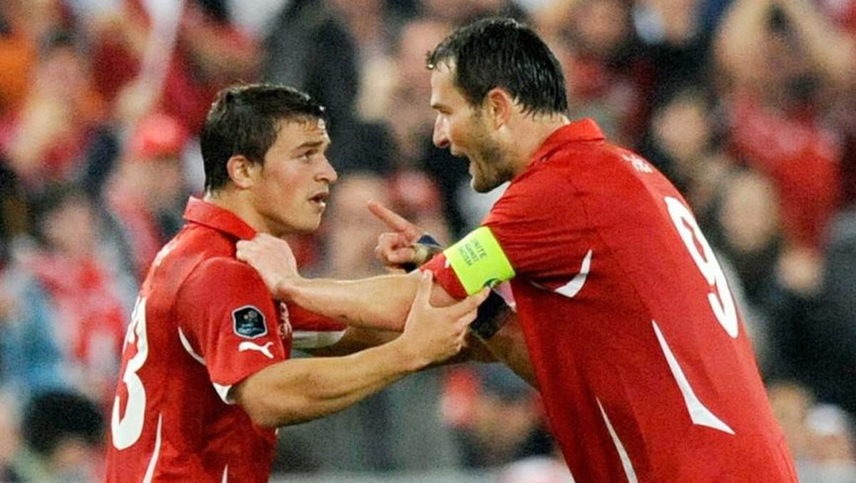 Swiss forward Xherdan Shaqiri, left, celebrates after scoring a goal with Swiss forward Alexander "Alex" Frei, right, during the Euro 2012 group G qualification soccer match between Switzerl ...