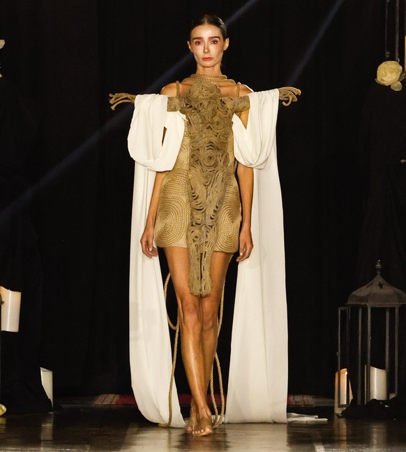 epa12225229 A model presents a creation from the Haute Couture Autumn/Winter 2025/2026 collection by Spanish designer Juana Martin during Paris Fashion Week, in Paris, France, 08 July 2025. The presen ...