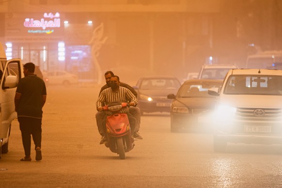 A motorcycle and cars travel along a street during a heavy dust storm in Najaf, Iraq, Monday, May 18, 2026. (AP Photo/Anmar Khalil)
Iraq Dust Storm
