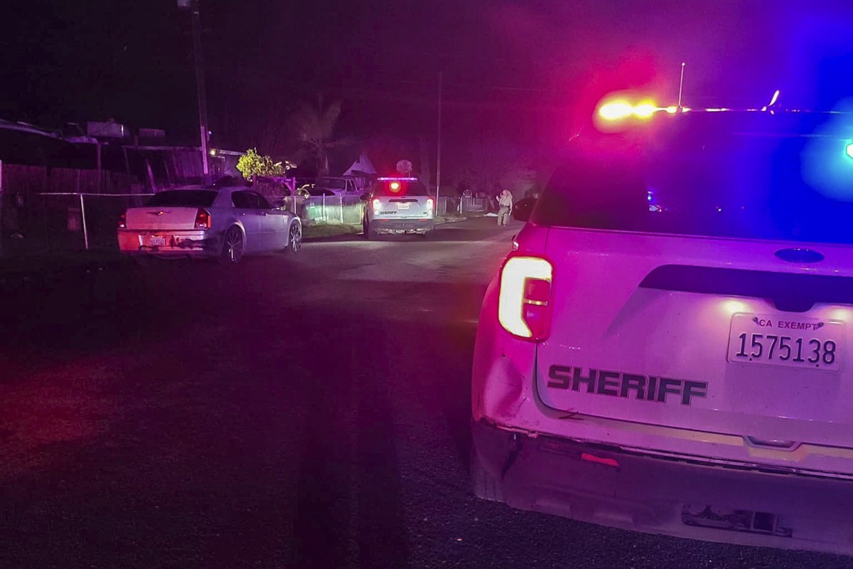 In this image released by Tulare County Sheriff's Office, detectives investigate a shooting in Goshen near Visalia, Calif., early morning Monday, Jan. 16, 2023. Sheriff's officials say six p ...