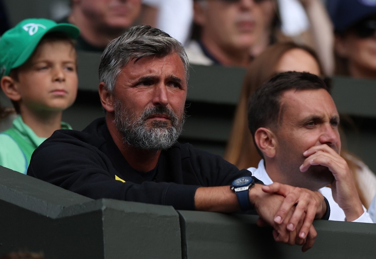 epa10724320 Goran Ivanisevic, coach of Novak Djokovic of Serbia watches him play Pedro Cachin of Argentina in their 1st round match at the Wimbledon Championships, Wimbledon, Britain, 03 July 2023. EP ...