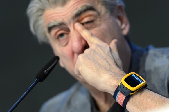CEO of Swatch Group Nick Hayek speaks while posing with a watch &quot;Swatch Touch Zero One&quot;, at a press conference of the year 2014 final results of Swiss watch company Swatch Group, in Corgemon ...