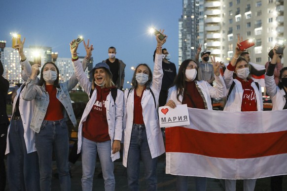 Belarusian medical workers gesture during a rally in support of Maria Kolesnikova, and other members of the Coordination Council created by the opposition to facilitate talks with Lukashenko on a tran ...