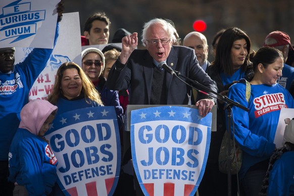 epa05664164 US Senator from Vermont and former Presidential Candidate Bernie Sanders (C) delivers remarks at the Our Revolution and Good Jobs Nation rally in Washington, DC, USA, 07 December 2016. Sen ...