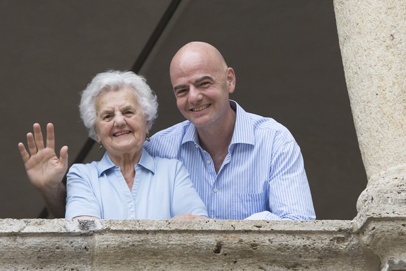 FIFA President Gianni Infantino, right, poses his his mother Maria, left, before the Gianni's game a soccer match with many football legends, in Brig, Switzerland, Friday, July 7, 2017. (KEYSTONE ...