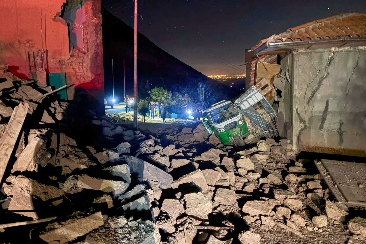 A motor tricycle is stuck amid the debris of homes that collapsed after an earthquake struck Pumpuya, Peru, Sunday, July 19, 2026. ( AP Photo/Jhefry Sedano)
Peru Earthquake