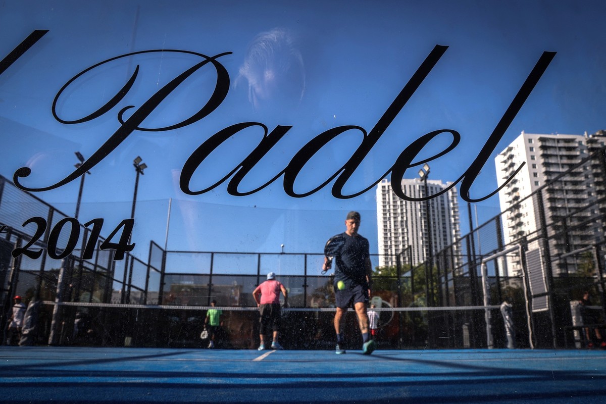 People play padel on a court in Miami, Florida, on March 22, 2026. Padel, the racket sport that originated among the elites of Latin America and Spain, has exploded in popularity in Miami. Fans say it ...