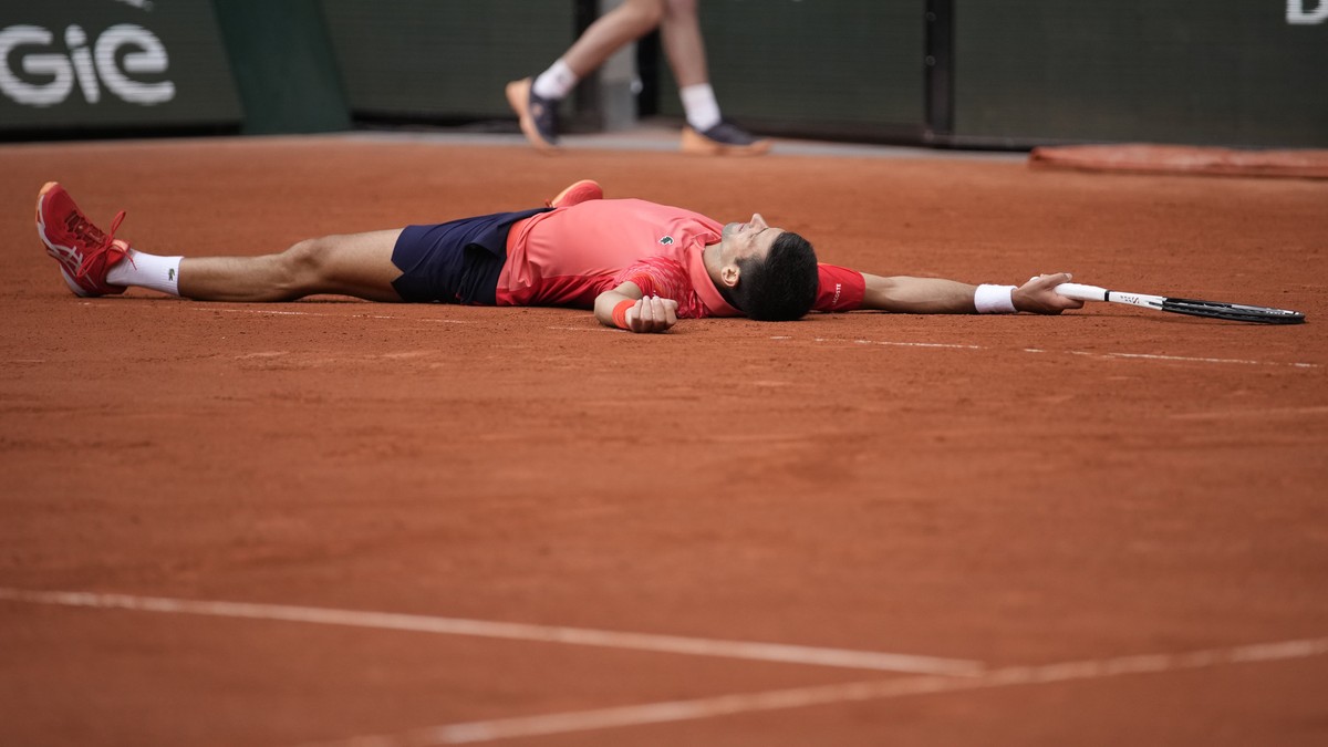 Serbia's Novak Djokovic celebrates winning the men's singles final match of the French Open tennis tournament against Norway's Casper Ruud in three sets, 7-6, (7-1), 6-3, 7-5, at the Ro ...