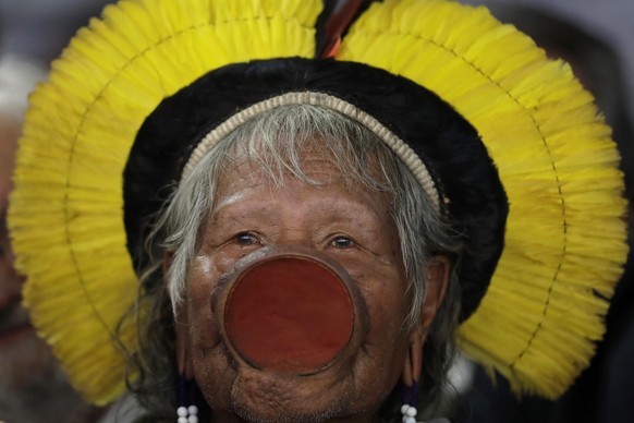 Brazilian indigenous chief Raoni Metuktire attends a meeting with lawmakers and other organizations in the House of Representatives, in Brasilia, Brazil, Wednesday, Sept. 25, 2019. The Kayapo chieftai ...
