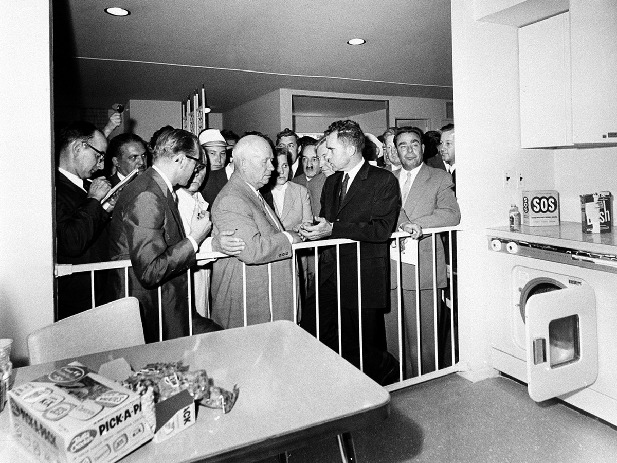 U.S. Vice President Richard Nixon, center, and Soviet Premier Nikita Khrushchev, left center, are engaged in a discussion as they stand in front of a kitchen display at the United States exhibit at Mo ...