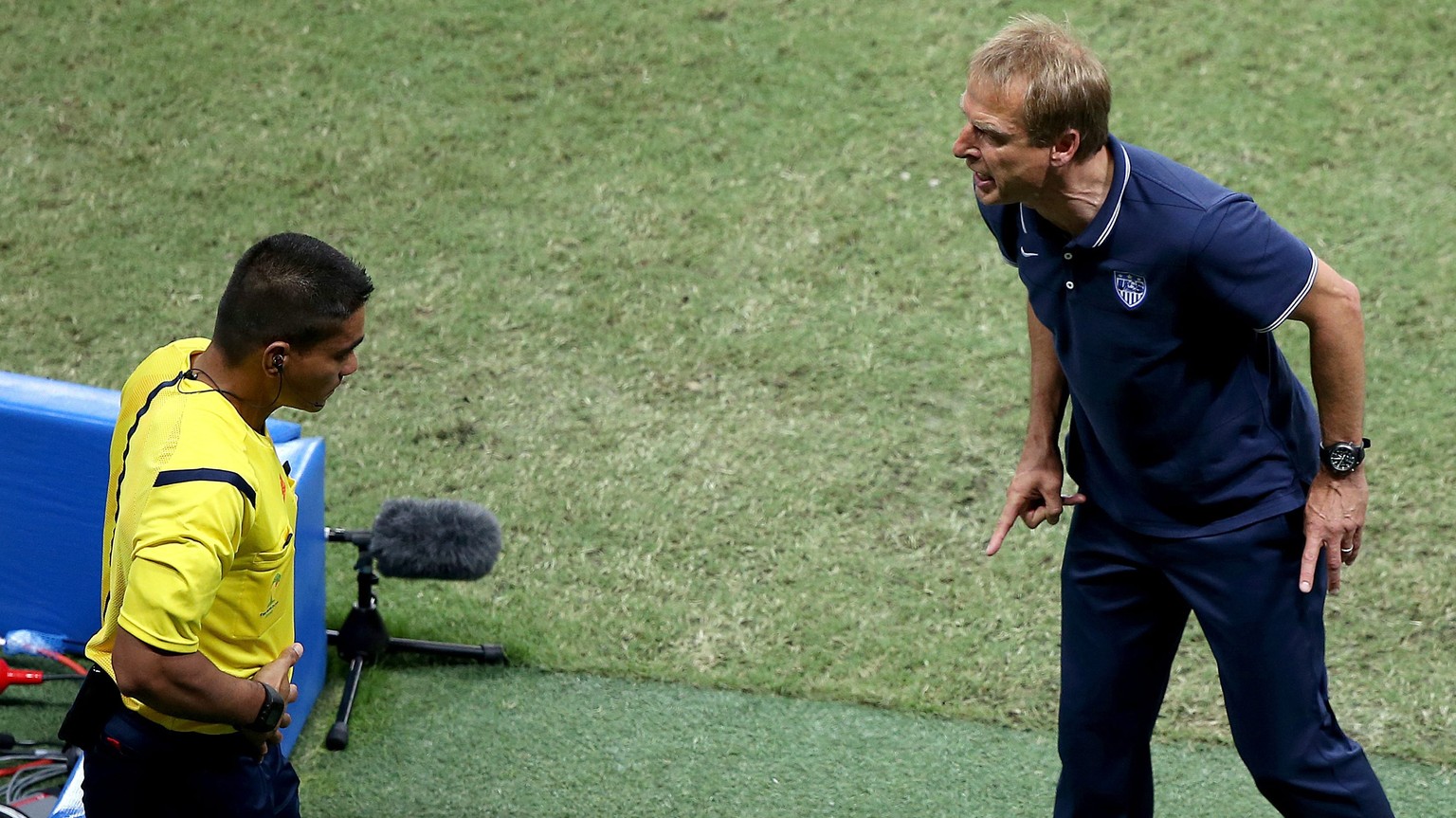 epa04294995 USA coach Juergen Klinsmann argues with a referee during the FIFA World Cup 2014 round of 16 match between Belgium and the USA at the Arena Fonte Nova in Salvador, Brazil, 01 July 2014. 
 ...