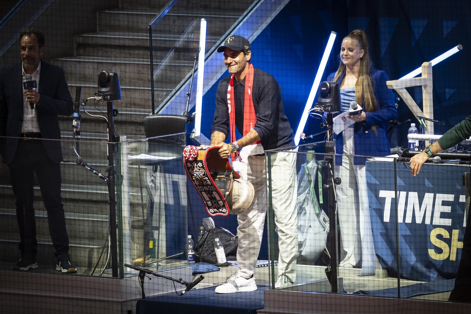 epa13001096 Roger Federer, former Swiss tennis player, rings the cowbell, prior the 2026 IIHF Men's Ice Hockey World Championship Quarterfinal game between Switzerland and Sweden, in Zurich, Swit ...