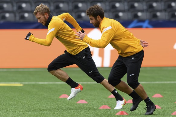 Young Boys&#039; Fabian Lustenberger, left, and Young Boys&#039; Miralem Sulejmani, right, in action during a training session ahead of Wednesday&#039;s UEFA Champions League soccer match between BSC  ...