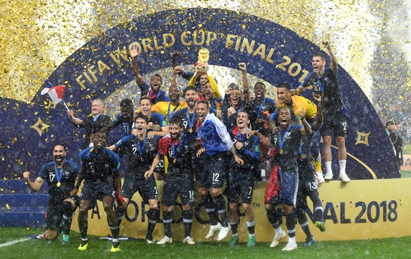 epa06891476 French player react with the trophy after winning the FIFA World Cup 2018 final between France and Croatia in Moscow, Russia, 15 July 2018.

(RESTRICTIONS APPLY: Editorial Use Only, not  ...