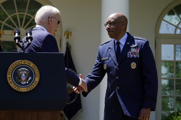 President Joe Biden shakes hands with Chief of Staff of the United States Air Force, General CQ Brown, Jr., after nominating Brown as the next Chairman of the Joint Chiefs of Staff, in the rose garden of the White House...