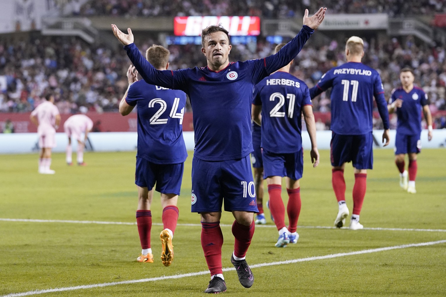 Chicago Fire midfielder Xherdan Shaqiri celebrates after scoring his second goal during the second half of an MLS soccer game against the Inter Miami in Chicago, Wednesday, Oct. 4, 2023. (AP Photo/Nam ...