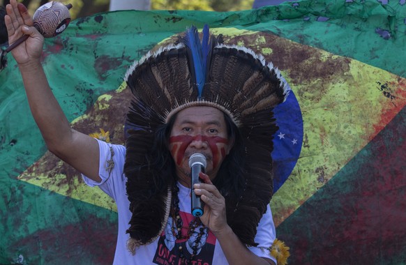 epa10022411 A person attends a protest demanding justice after British journalist Dom Phillips and native activist Bruno Araujo were killed in Brasilia, Brazil, 19 June 2022. Corpses of Dom Phillips a ...