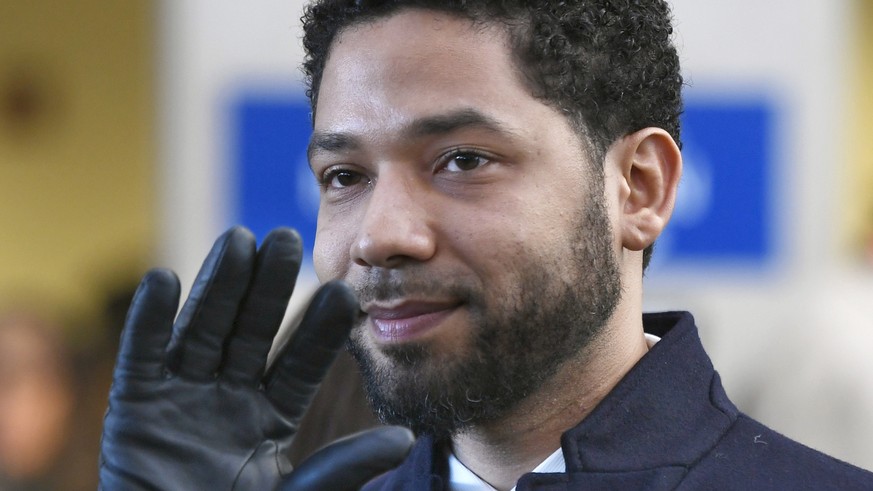 FILE - In this March 26, 2019, file photo, actor Jussie Smollett smiles and waves to supporters before leaving Cook County Court after his charges were dropped in Chicago. The city of Chicago is suing ...