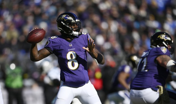 Baltimore Ravens quarterback Lamar Jackson (8) looks to pass in the first half of an NFL football game against the Carolina Panthers Sunday, Nov. 20, 2022, in Baltimore. (AP Photo/Nick Wass)
Lamar Jac ...