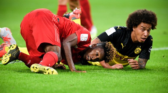 epa07755344 Bayern&#039;s Kingsley Coman (L) in action against Dortmund&#039;s Axel Witsel (R) during the German Supercup soccer match between Borussia Dortmund and FC Bayern Muenchen in Dortmund, Ger ...