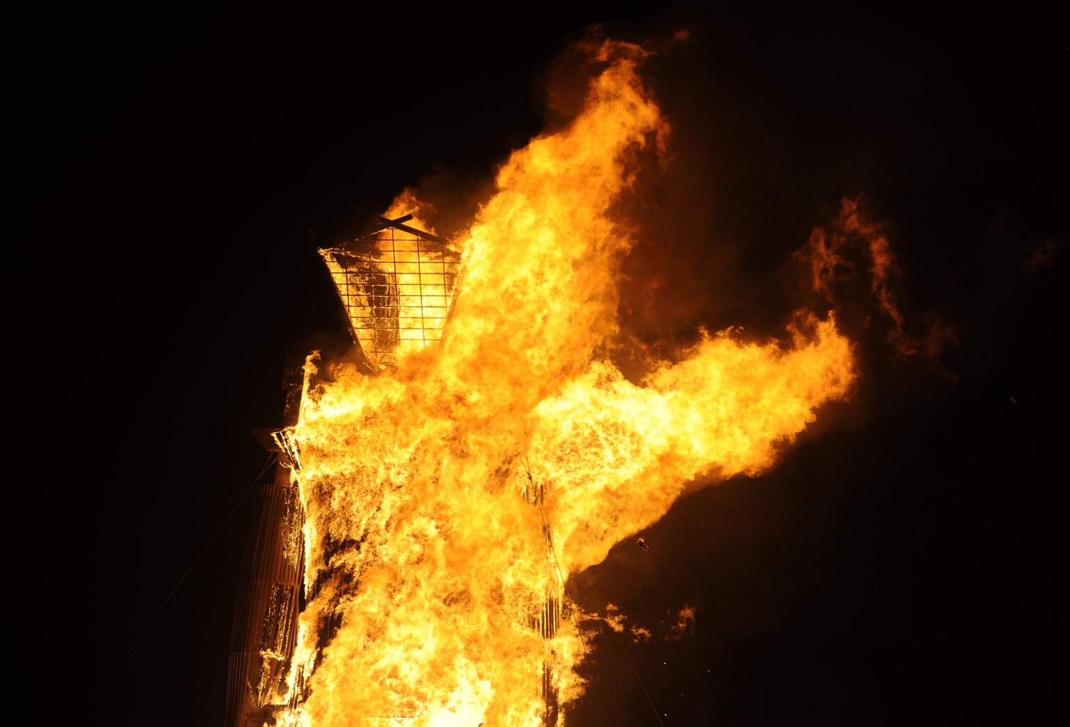 The man burns at the annual Burning Man event on the Black Rock Desert of Gerlach, Nevada on Aug. 30, 2014. (AP Photo/Reno Gazette-Journal, Andy Barron)
