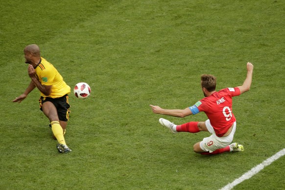 England&#039;s Harry Kane, right, makes an attempt to score as Belgium&#039;s Vincent Kompany defends during the third place match between England and Belgium at the 2018 soccer World Cup in the St. P ...