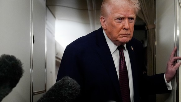 President Donald Trump speaks to reporters while in flight on Air Force One to Joint Base Andrews, Md., Sunday, Jan. 11, 2026. (AP Photo/Julia Demaree Nikhinson)
Donald Trump