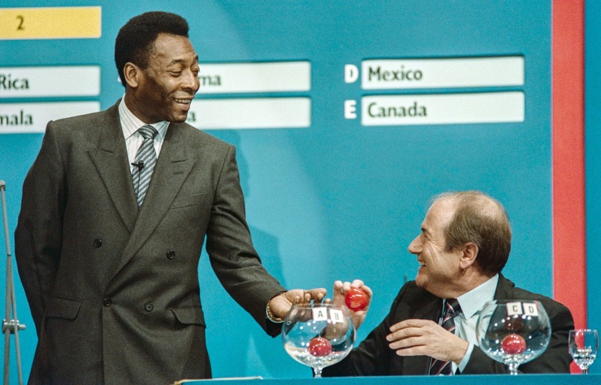 Pele, left, and FIFA Secretary-General Sepp Blatter, right, during the draw of the groups for the qualifying matches for the World Cup in Italy in 1990, pictured in December of 1987 in Zurich, Switzer ...
