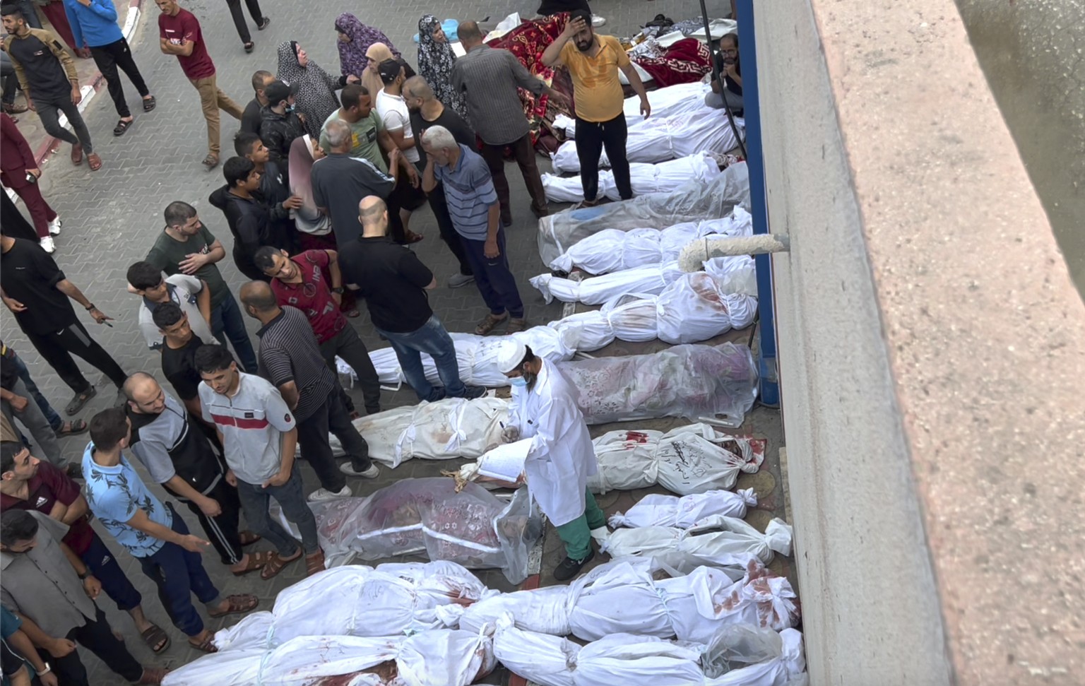 EDS NOTE: GRAPHIC CONTENT - In this frame grab from video, covered bodies lie outside an Indonesian hospital following Israeli airstrikes at the Jabaliya refugee camp on Gaza City?s outskirts, Tuesday ...