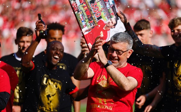 epa10657861 Union?s head coach Urs Fischer celebrates with his team after qualifying for the UEFA Champions League after the German Bundesliga soccer match between Union Berlin and SV Werder Bremen in ...