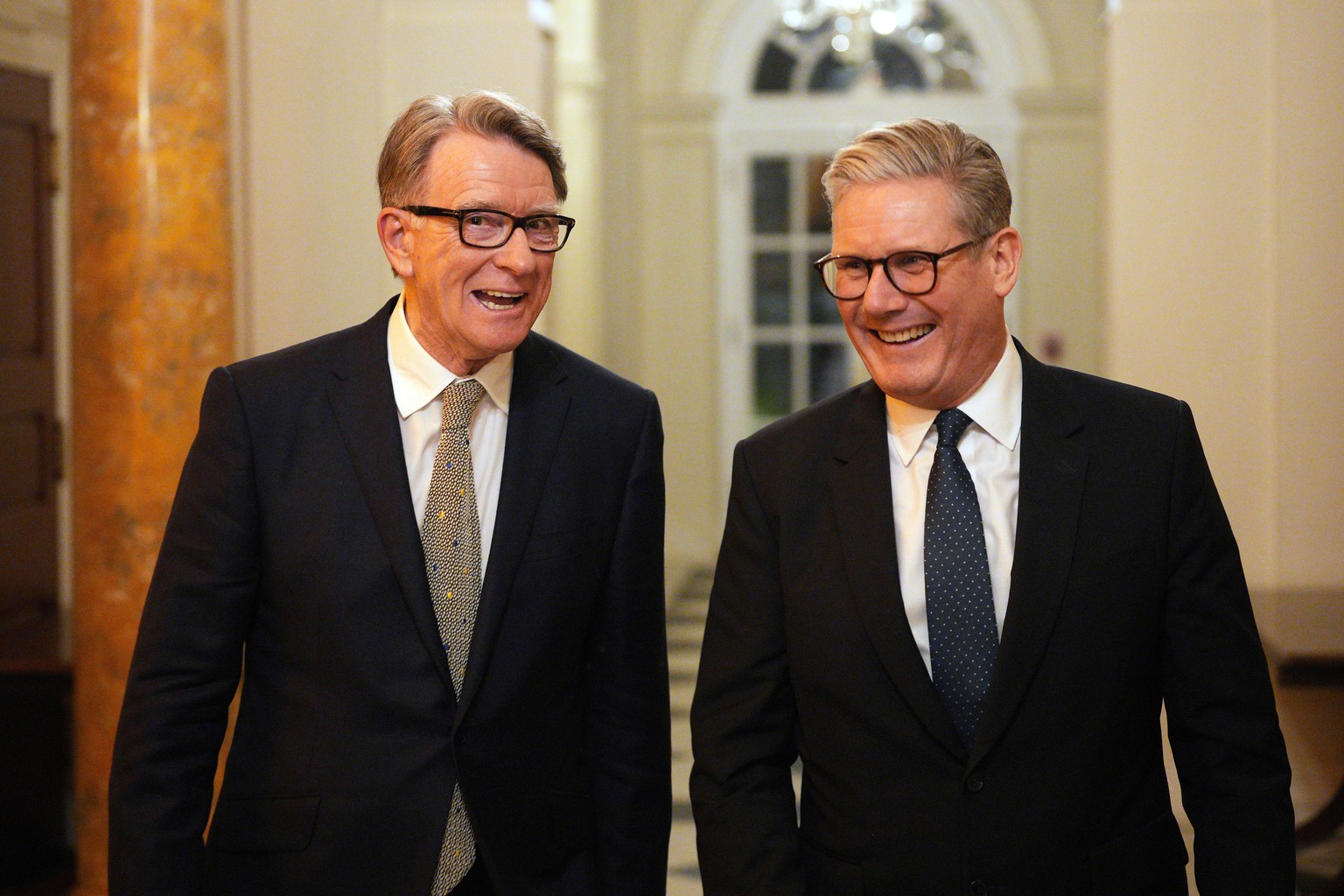 FILE - British Prime Minister Keir Starmer, right, talks with Britain's ambassador to the United States Peter Mandelson during a welcome reception at the ambassador's residence on Wednesday, ...