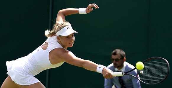 epa07687149 Dayana Yastremska of Ukraine in action against Camila Giorgi of Italy during their first round match at the Wimbledon Championships at the All England Lawn Tennis Club, in London, Britain, ...