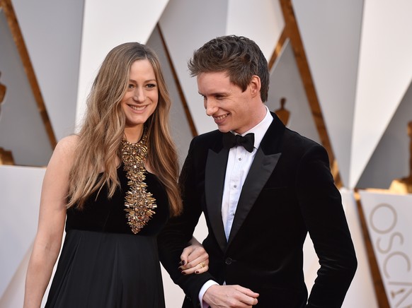 FILE - In a Sunday, Feb. 28, 2016 file photo, Hannah Bagshawe, left, and Eddie Redmayne arrive at the Oscars, at the Dolby Theatre in Los Angeles. Redmayne and his wife Hannah Redmayne are officially  ...