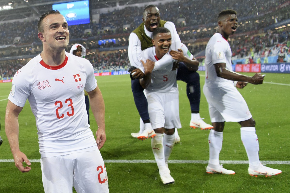 Switzerland's midfielder Xherdan Shaqiri, left, Switzerland's goalkeeper Yvon Landry Mvogo, center, Switzerland's defender Manuel Akanji, center No5, and Switzerland's forward Bree ...