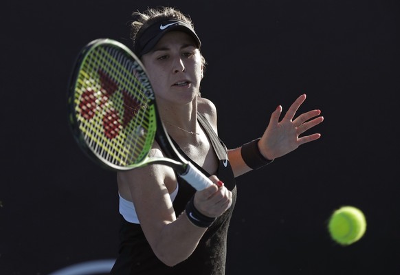 Switzerland&#039;s Belinda Bencic makes a forehand return to Katerina Siniakova of the Czech Republic during their first round match at the Australian Open tennis championships in Melbourne, Australia ...