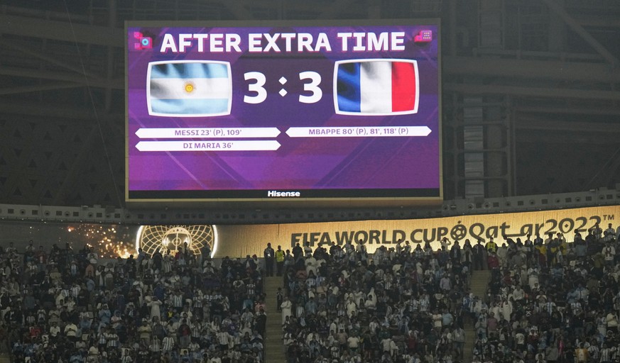 A video screen shows the score at the end of extra time during the World Cup final soccer match between Argentina and France at the Lusail Stadium in Lusail, Qatar, Sunday, Dec. 18, 2022. (AP Photo/Ma ...